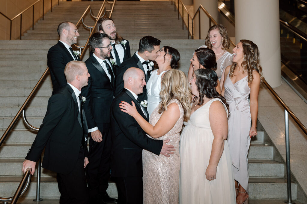 bridal party surrounding bride and groom indoor portraits