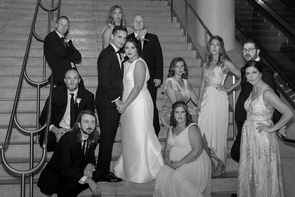 bridal party surrounding bride and groom indoor portraits