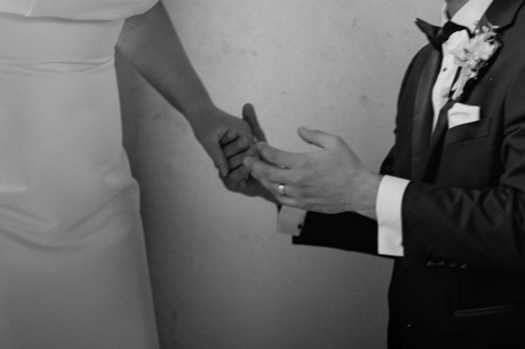 bride and groom holding hands black and white detail photos