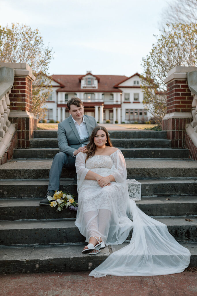 bride and groom bridal portraits on the steps of longview mansion in Missouri