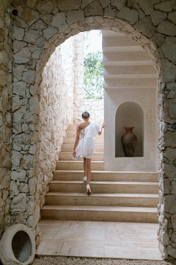 bride walking up stairs tropical mexico elopement