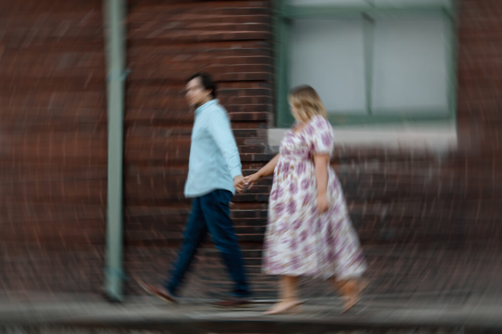 candid blurry couple photos walking and holding hands