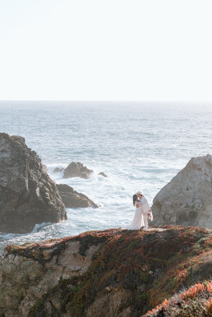 couple kissing on california beach