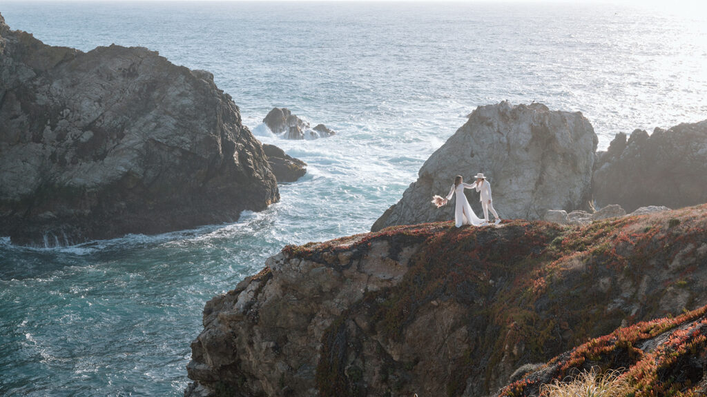 couple standing on cliffs for big sur california elopement