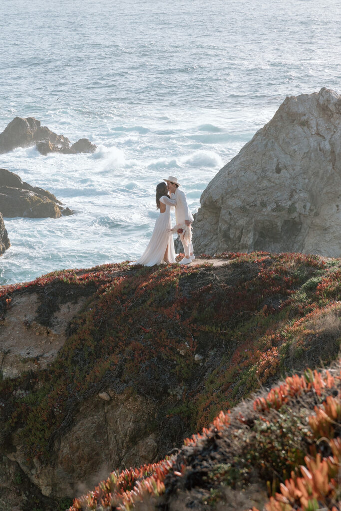 couple kissing intimate beach elopement