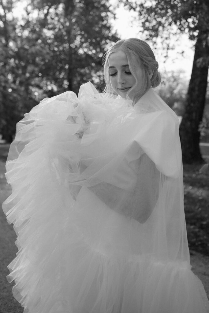 bridal portraits outdoors with veil and tulle dress