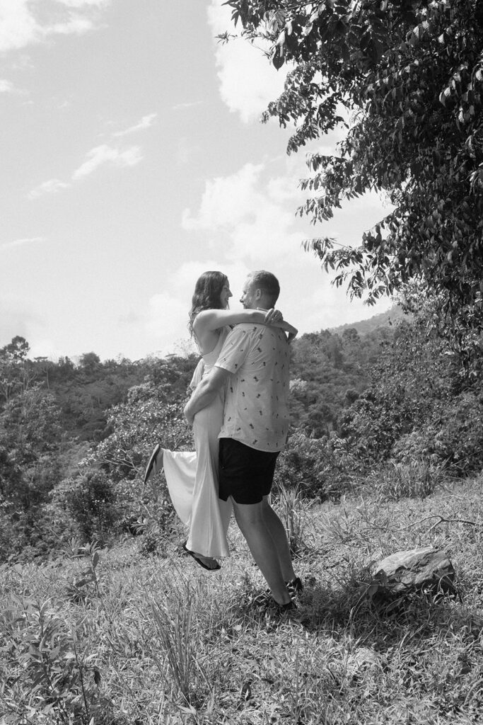 bride and groom lift post for tropical adventure elopement