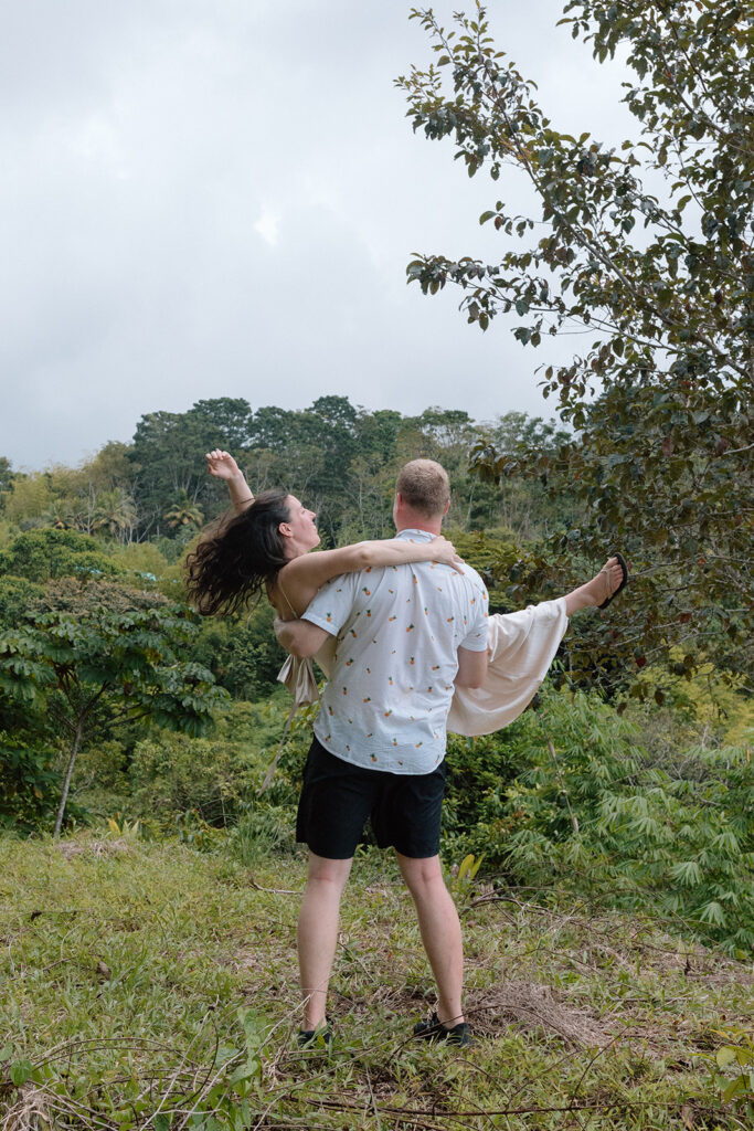 couple lift post candid elopement photo poses