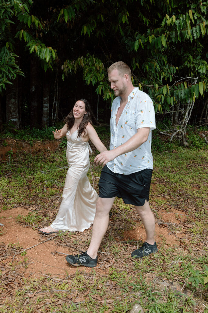 couple holding hands and walking in costa rica