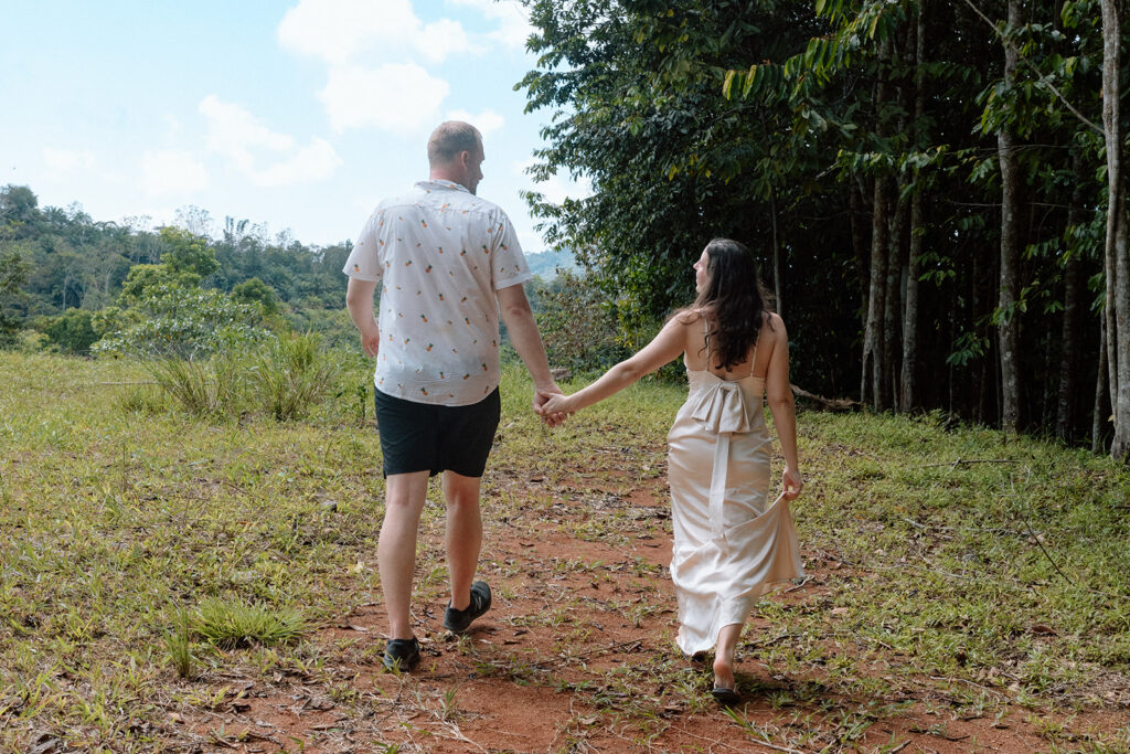 couple holding hands and walking during costa rica elopement