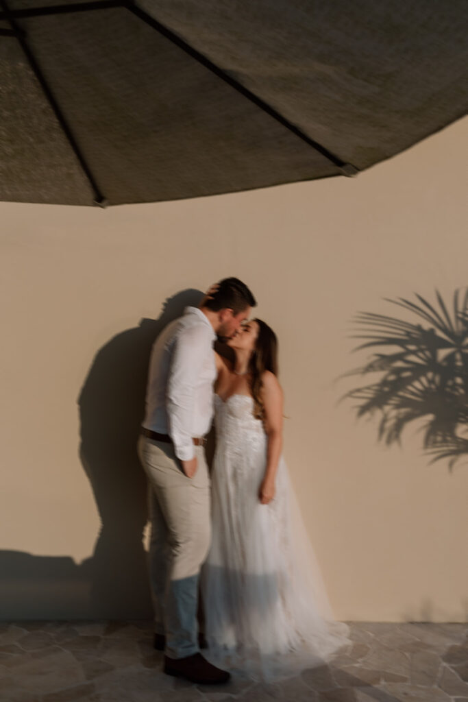 candid and romantic kiss photos of bride and groom