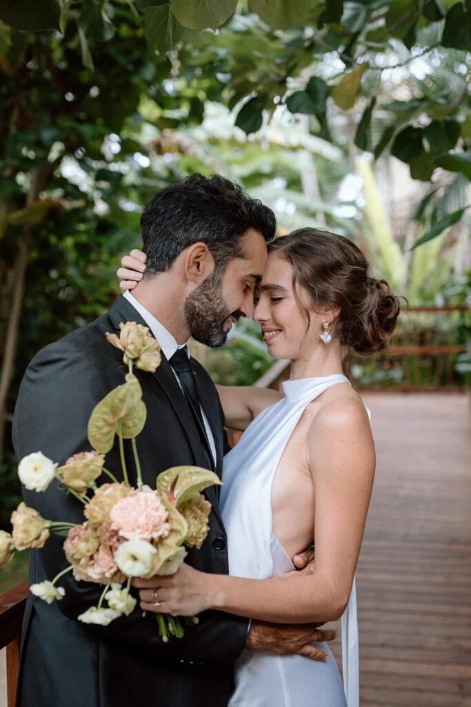 bride and groom portraits in tulum mexico on the beach