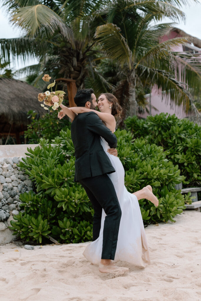 bride and groom portraits in tulum mexico on the beach