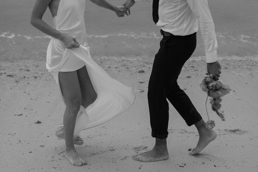 bride and groom dancing on the beach