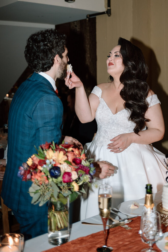 bride and groom cutting the cake