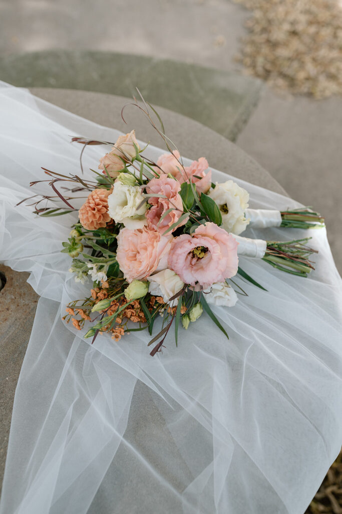 bright wedding florals with veil