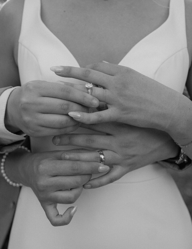 wedding ring photos bride and groom holding hands