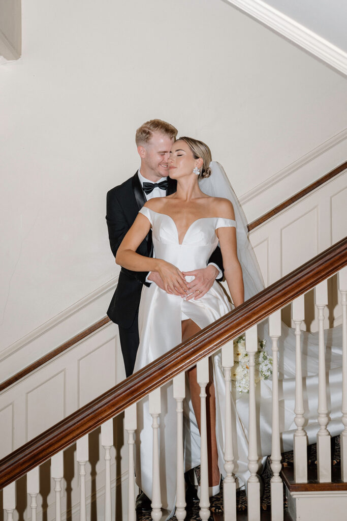 A flash wedding photo on the staircase at the Historic Longview Mansion wedding venue.