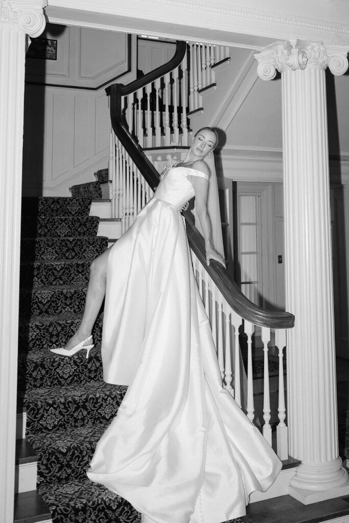 A black and white editorial wedding photo featuring a Stephanie's Bridal Boutique gown.