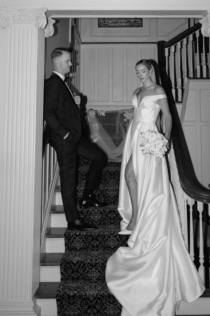 A black and white candid wedding picture at Longview Mansion for a styled shoot.