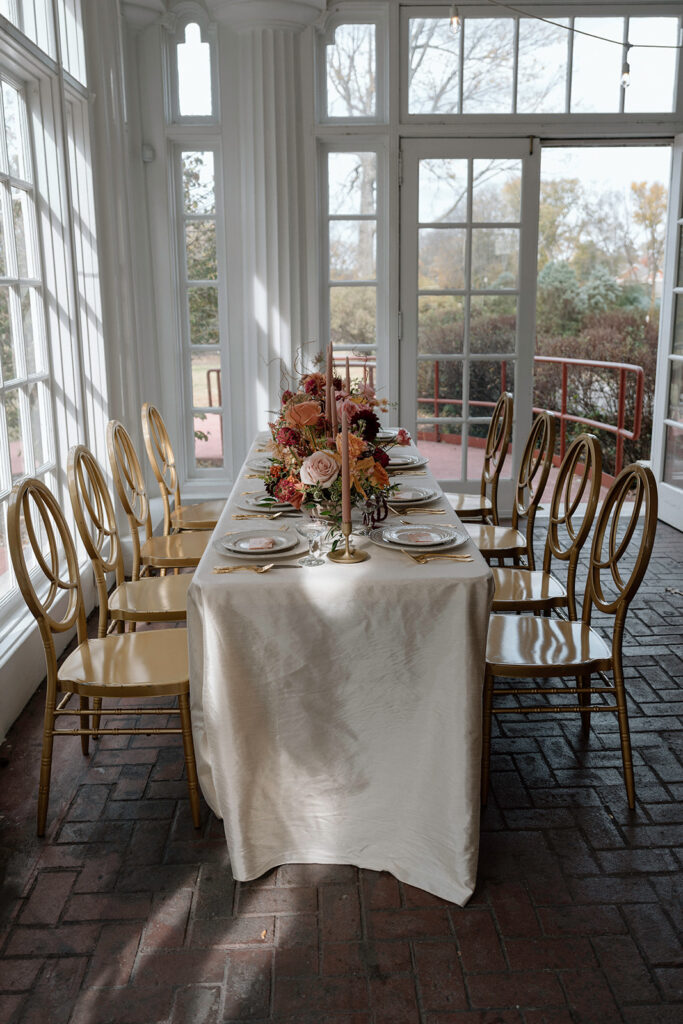 A luxury tablescape design with linens from Quest Events and Floriography bouquets.