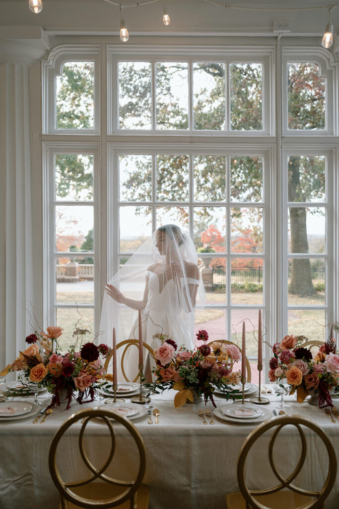 A styled editorial wedding at Longview Mansion with a luxury wedding gown, fall inspired wedding flowers, and elegant wedding details.