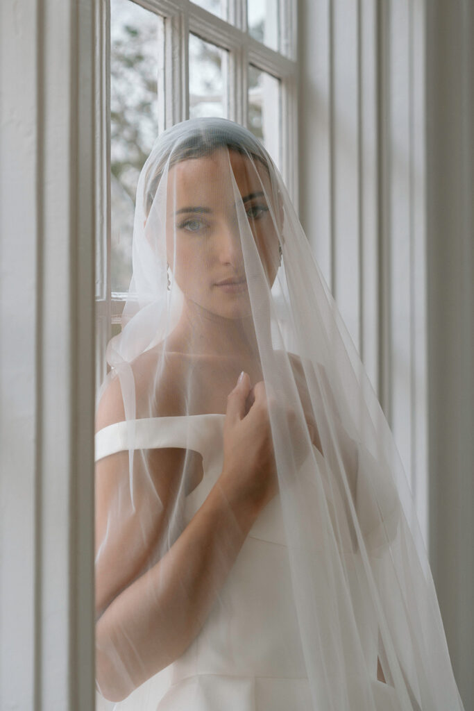 An intimate bridal portrait of the bride modeling for a styled Kansas City wedding at Longvew Mansion,