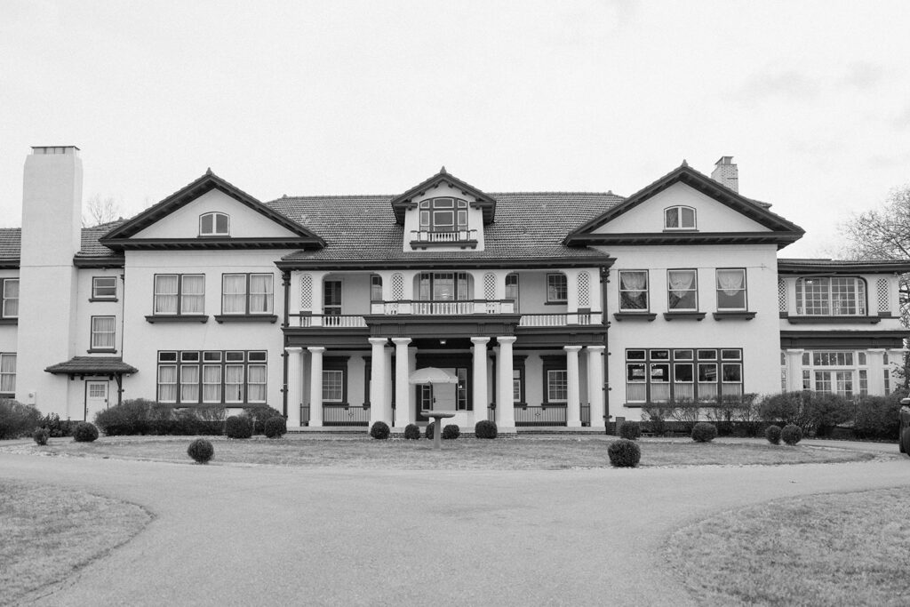 A photograph of the Historic Longview Mansion, a Kansas City wedding venue, in black and white.