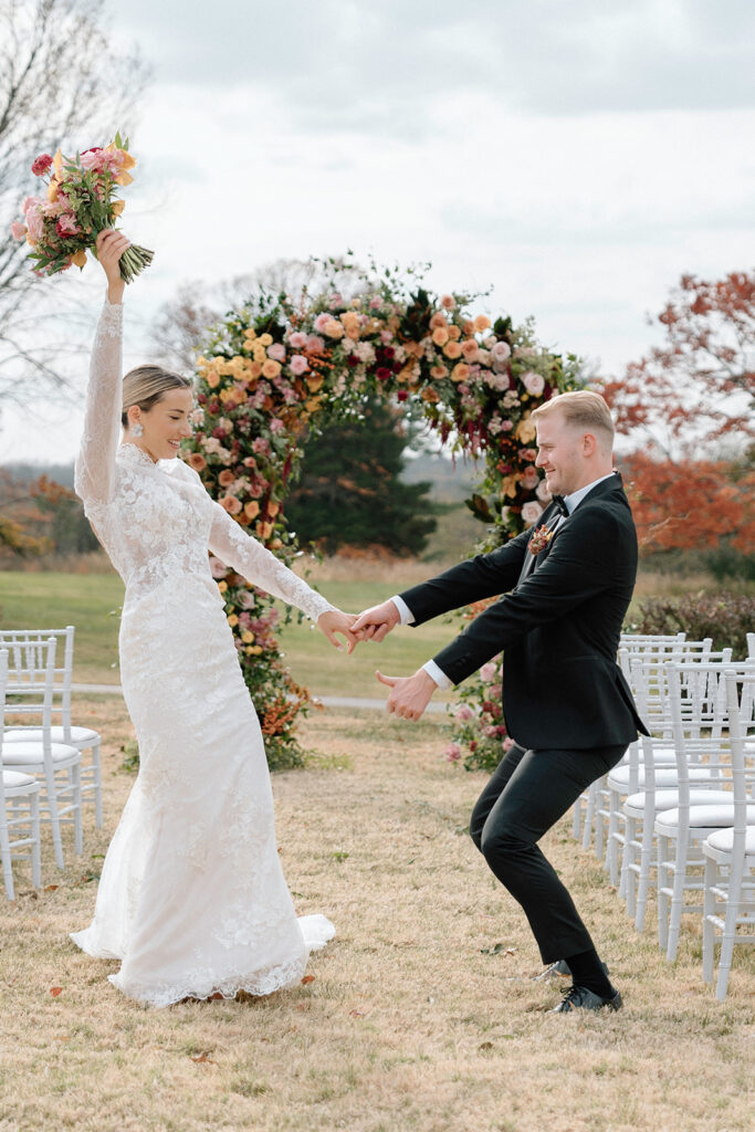 The model bride and groom celebrate the Longview Mansion wedding styled shoot with a dance.