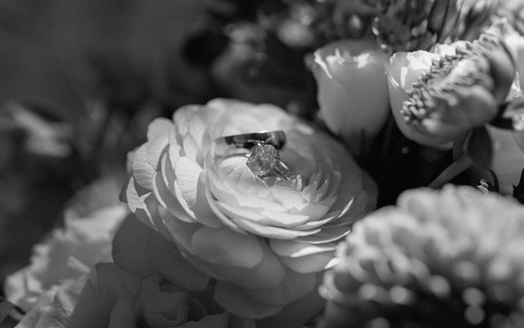 bridal bouquet designed by Gather at Red Cedar Gardens with the bride and groom rings