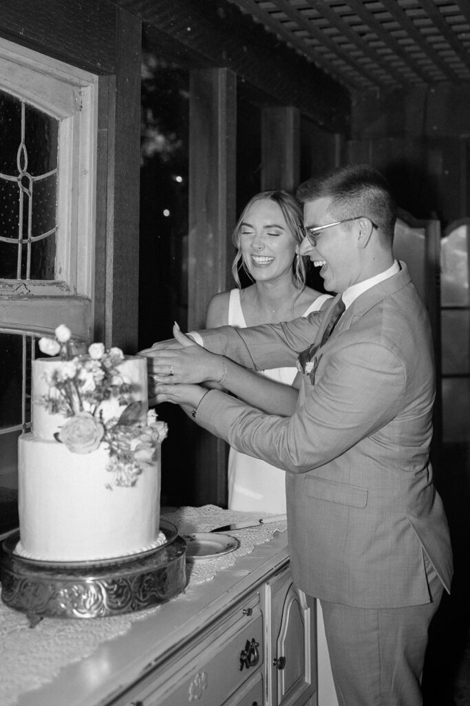 bride and groom cutting the cake