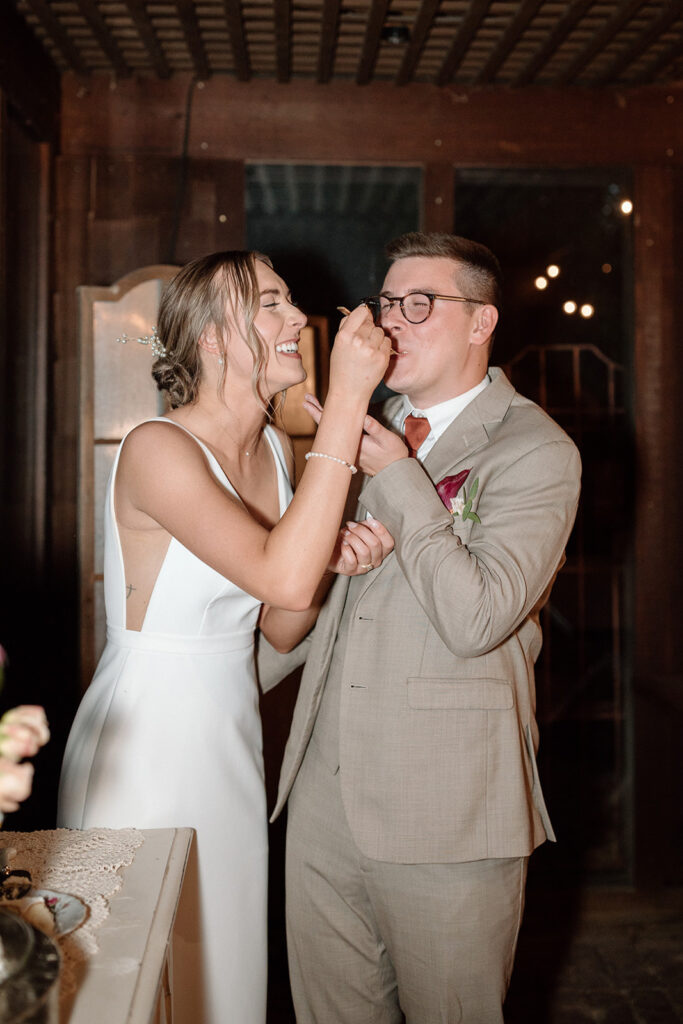 bride and groom cutting the cake