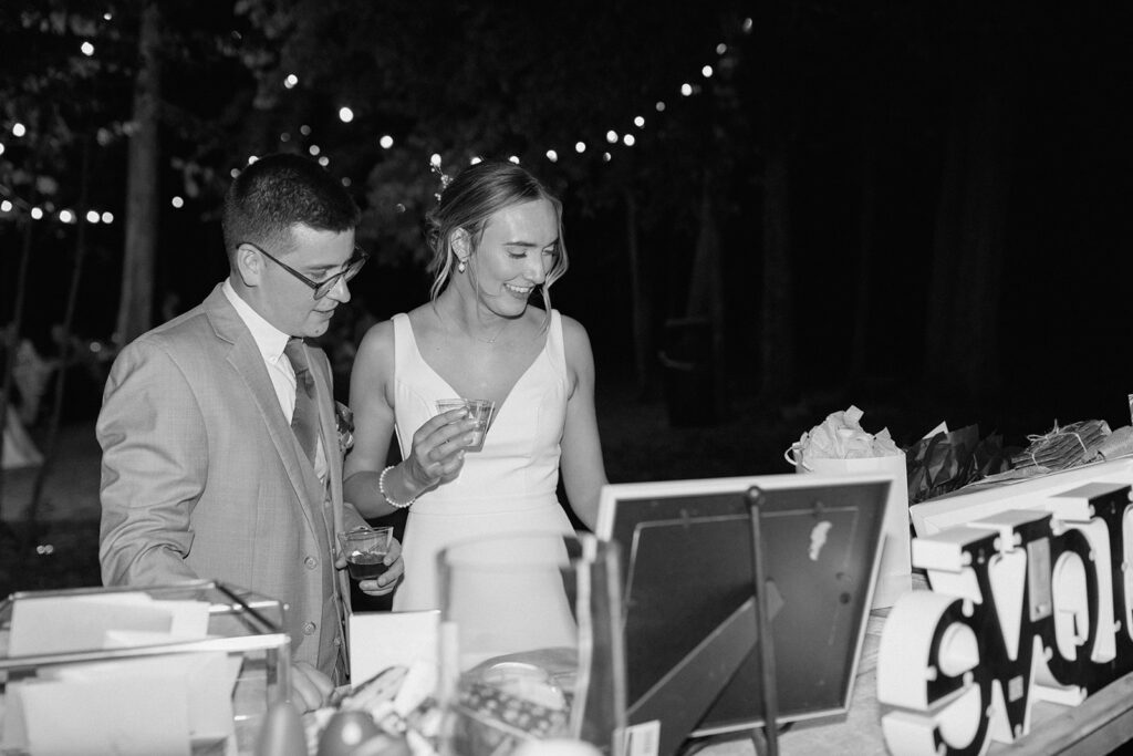 bride and groom admiring their wedding guest book