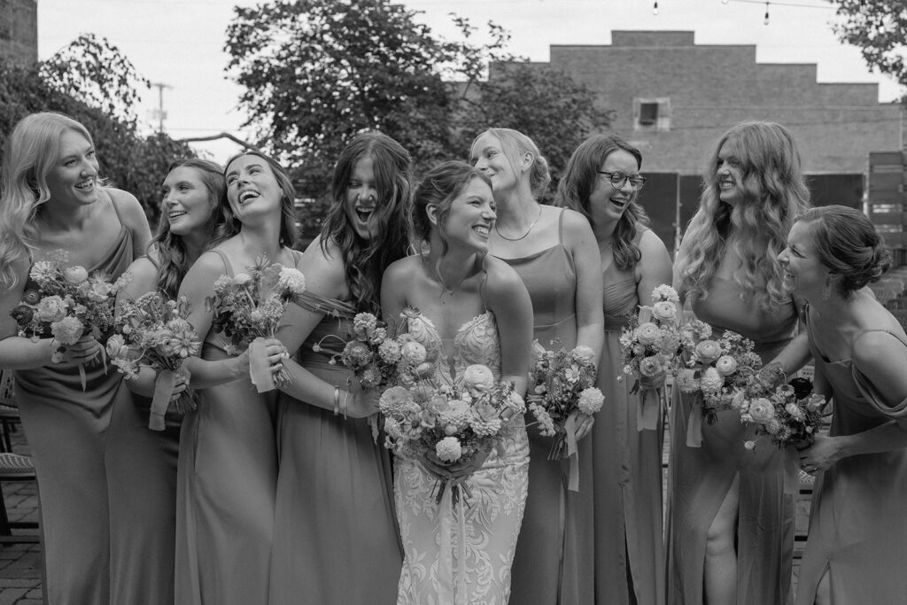 candid bridal party photos with bouquets from Solstice Floral Studio