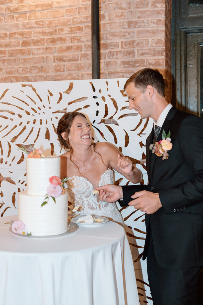 bride and groom cutting the cake