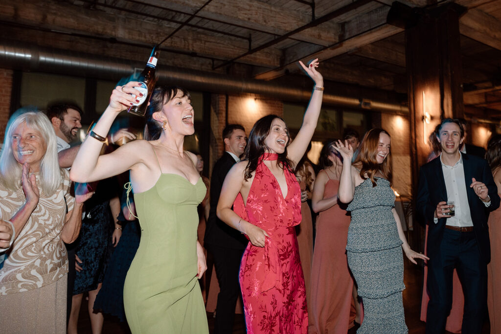 wedding guests dancing as captured by Kansas City wedding photographer