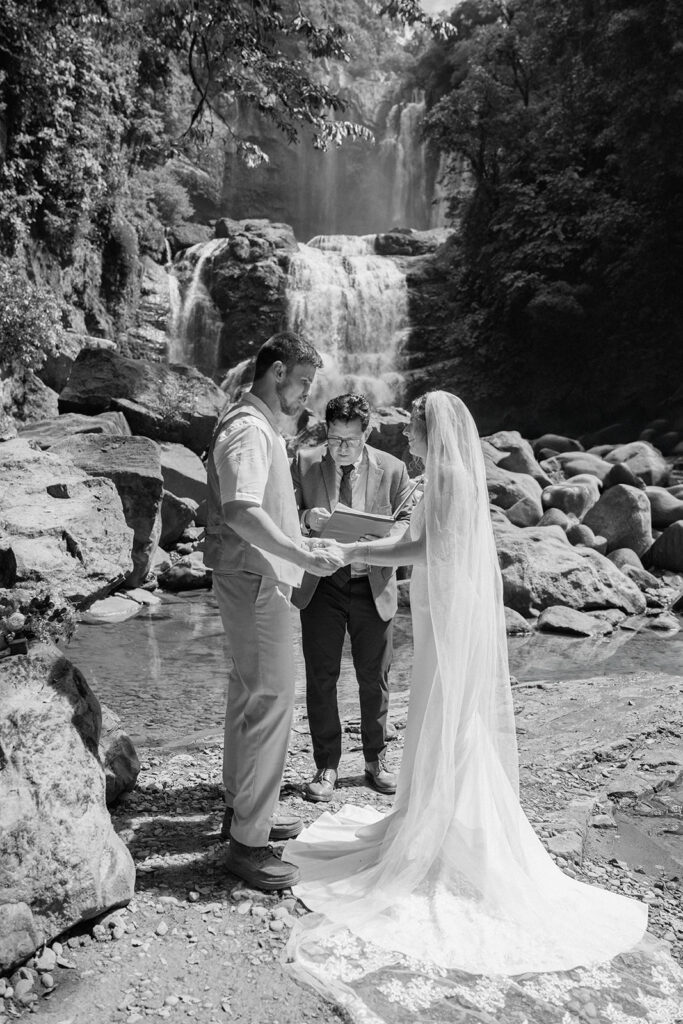 An image in black and white of tropical waterfall elopement details.
