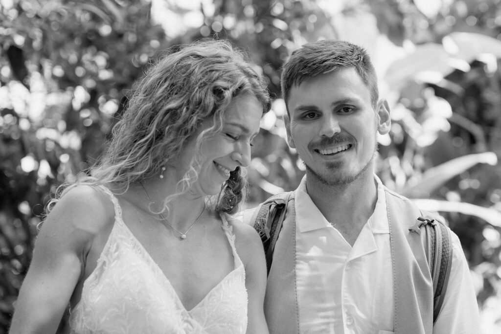 A black and white romantic wedding picture of the newlyweds.