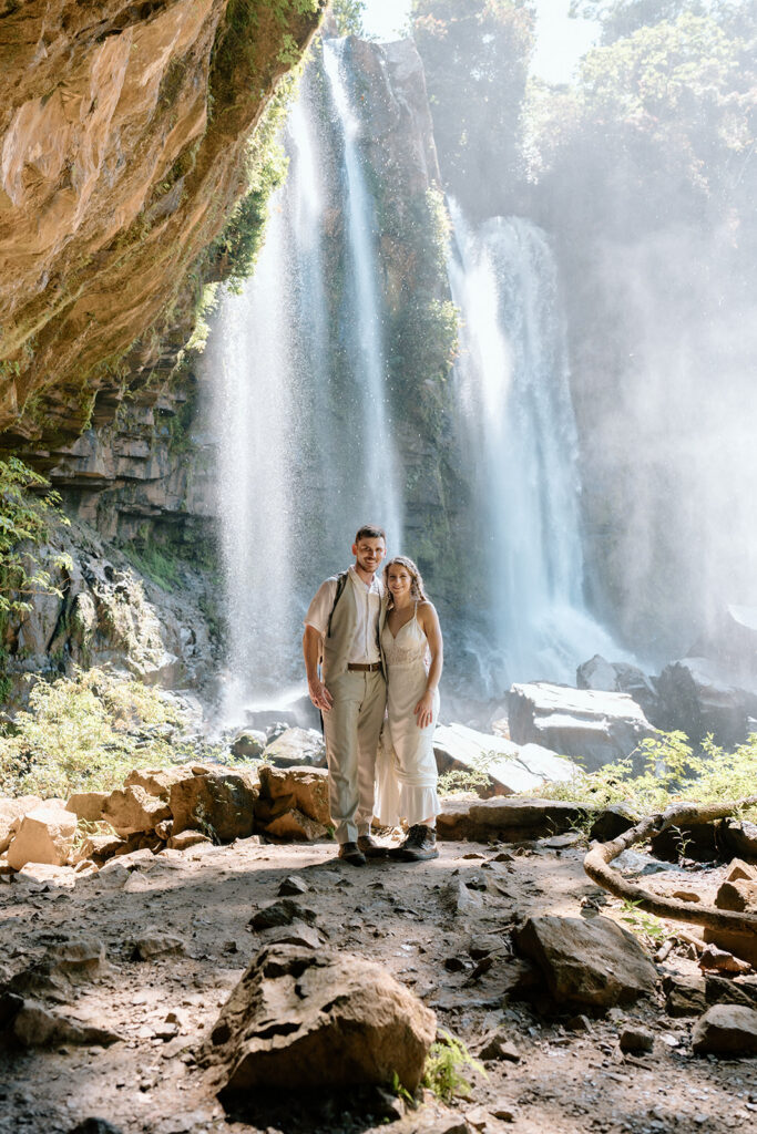 A posed photo beside the waterfall.