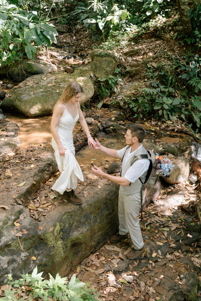 Hiking through the jungle during the adventure elopement.