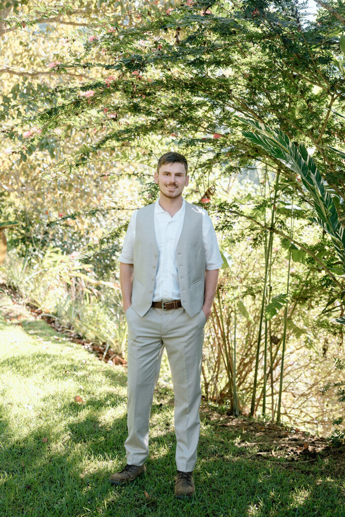 The groom getting ready before eloping at Nauyaca waterfall.